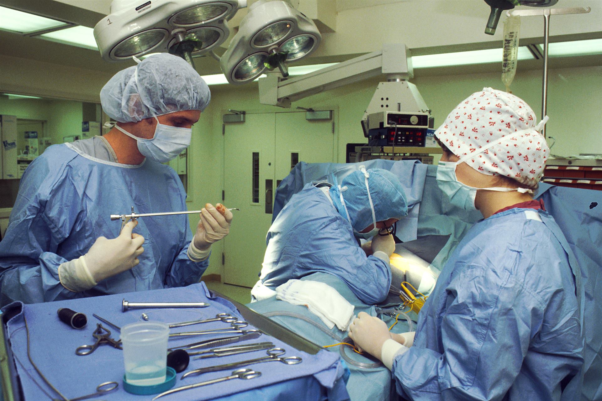 Modern hospital operating room equipped with sterile surgical disposables