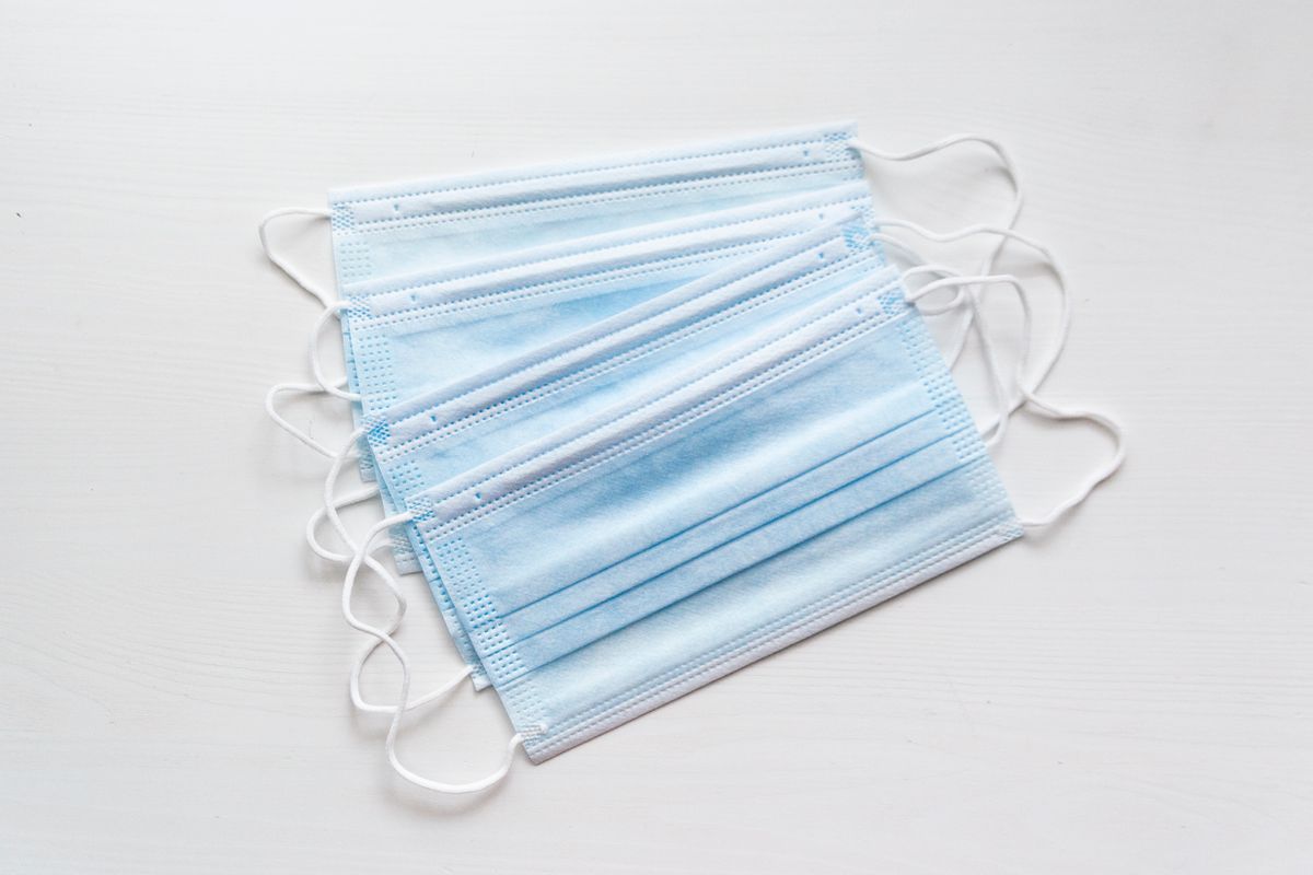 Stack of folded disposable surgical face masks